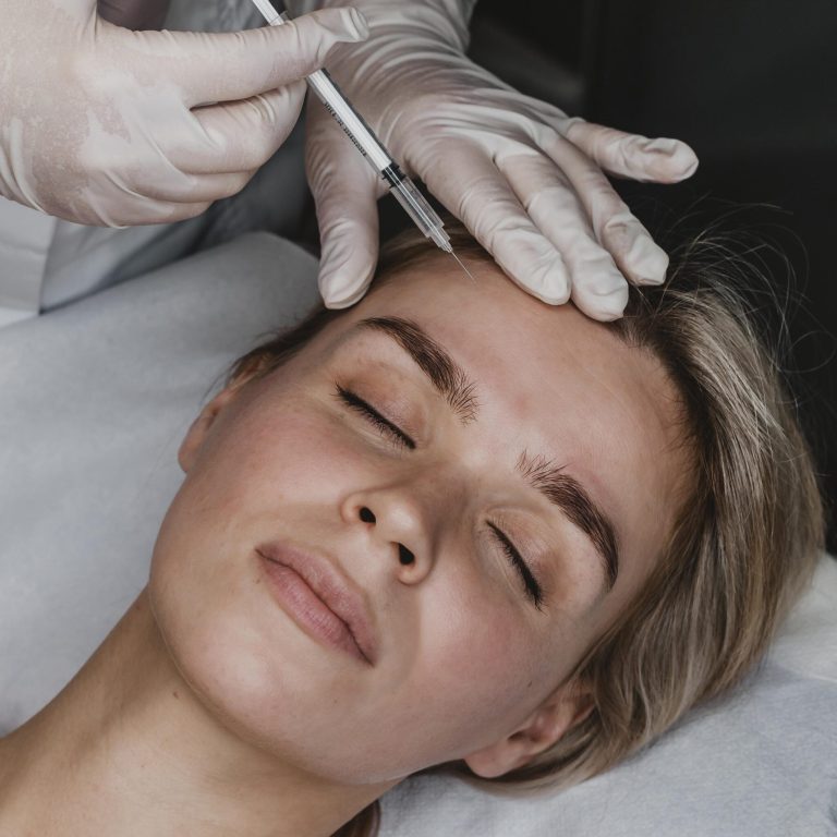 doctor performs mesotherapy to her woman patient