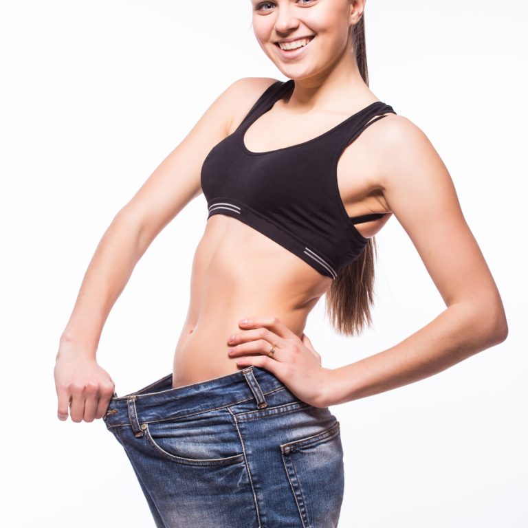 a woman patient in the photo shows her body after gastric balloon treatment